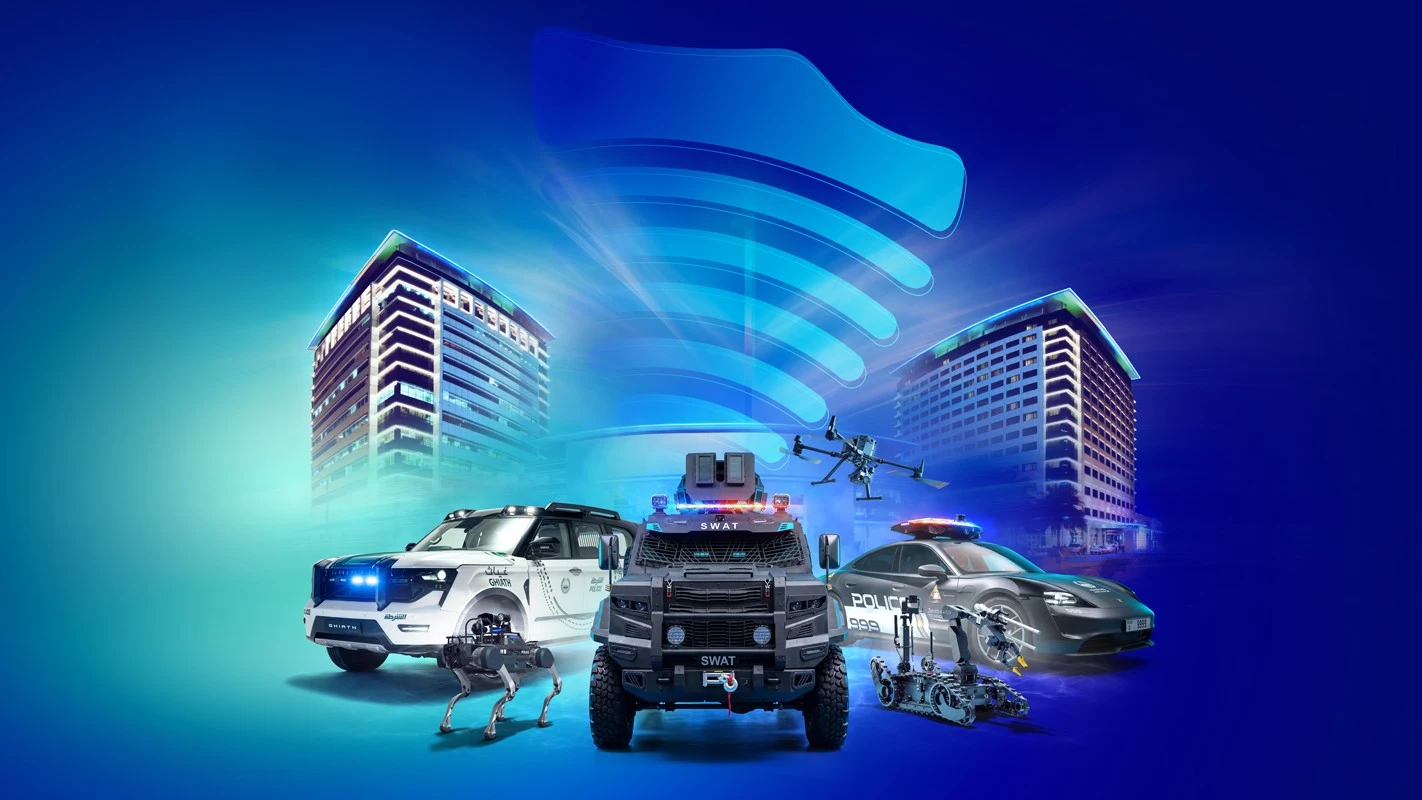 Police vehicles, a robot dog, a drone and a bomb-disposal robot in front of two towers